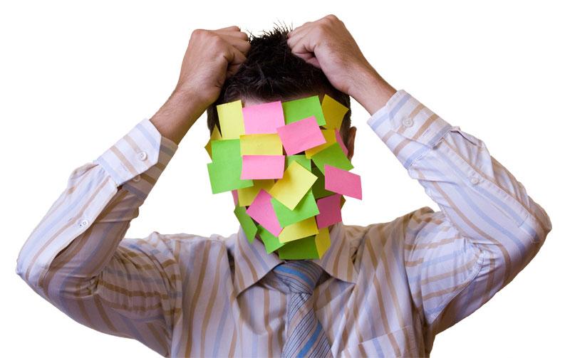 Confused man with post it notes